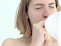 Skinny blonde teen bursts balloon