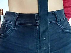 playing with a belt for pussy spanking
