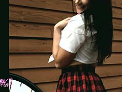 Brunette goddess worships outdoors seductively