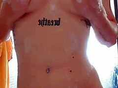 Shower scene with natural tits