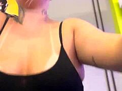 Tanned amateurs show off big natural tits in public gym