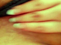 A horny woman with a shaved pussy masturbates and sends the video to her man