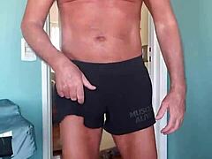 Muscle-clad perv enjoys feeling himself in snug shorts