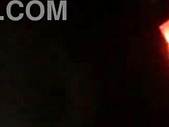 sexy tattooed curvy woman with piercings moaning softly in a relaxed setting