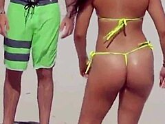 unbelievable young 18+ girl rocks micro bikini on beach with relatives