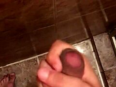 A skinny brazilian guy masturbates his huge dick, producing much cum.