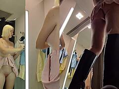 hidden camera captures upskirt view in dressing room of a juicy blonde pussy.