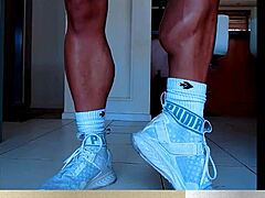 Muscular calves flex in bodybuilder legs showcase