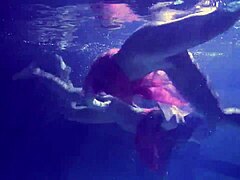 Lilia Mihalkova and Natalia Kupalka dive into underwater lesbian play in the pool
