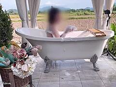 taking a relaxing bath outdoors in a serene rice field setting