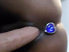 Latina mature uses black dildo on bed in solo session