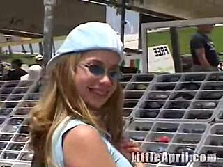 petite april teases herself in public restroom