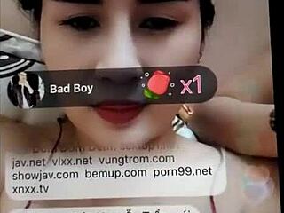 I'm watching a Vietnamese cam girl flash huge tits and take massive cock