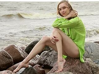 Natural blonde teen Annett poses by shore