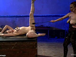 Busty Dominatrix Whips And Gags Bound Lesbian Slave