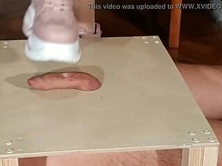 Domina stomps slave cock in pink boots