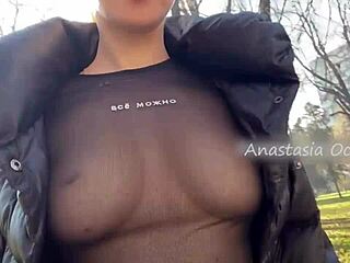 Raw blonde flashes huge tits in public park