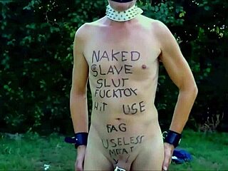 naked slave stripped in penis cage at outdoor party