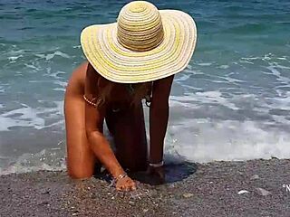 nippleringlover teases with extreme piercings on nude beach