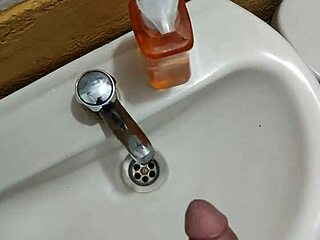 Young Guy Strokes Cock In Restaurant Bathroom