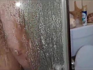 Stepsister fucks dildo in shower while watched