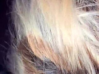 A mature woman gives a deep blow job to a big black cock