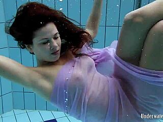Aneta flaunts big tits in purple dress underwater in pool