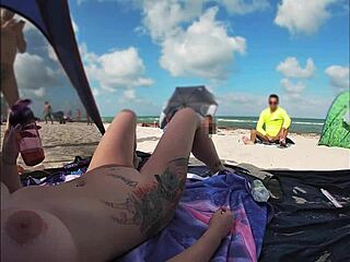 What does Mrs. Kiss reveal at the nude beach?