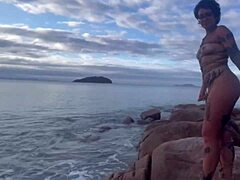 Anomaly Dark in shibari bondage with small tits exposed