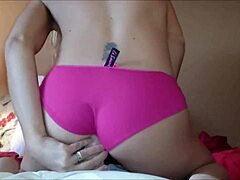 Sexy blond rips her clothes off in a homemade webcam striptease, masturbating intensely with dildo to orgasm.