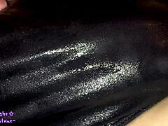 Transsexual in navy blue swimsuit gets coated with slippery lotion