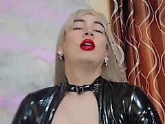 Latex transsexual in crossdressing gear masturbates intensely in POV.
