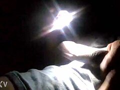 the electroman carefully strokes and calibrates his zapper in the lab