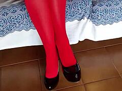 The Milf With Beautiful Legs In Red Pantyhose And Black Heels.