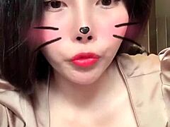 Asian girl shows off big tits in sexy live session