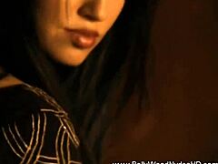 bolly babe dances seductively, stripping off clothes to reveal her gorgeous brunette curves in an exotic tease