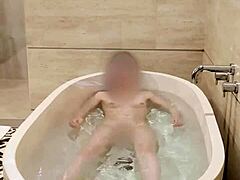 Hey, watch this cute Japanese college student bathing solo with her small tits and skinny body