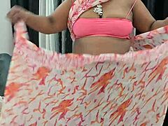 Indian bhabhi reveals her hot boobs in a tantalizing display of curves