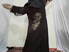 Hey, watch this Arabic slut in black hijab dancing erotically at home, shaking her small tits and curvy ass to music.