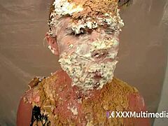 Two blondes get wet and messy while pieing each other in the face during a fun session