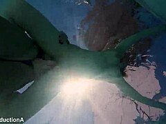 Underwater Lesbian Strap-On Action with Squirting and Ass Licking in Public Pool