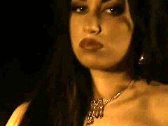 the narrative unfolds with a beautiful brunette indian woman dancing and undressing in a softcore striptease scene.