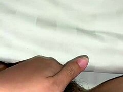 Inserting two fingers carefully inside during a personal moment with an Asian amateur in homemade style.