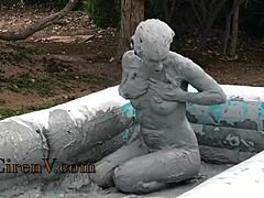 I'm covering myself in clay while sploshing in the pool