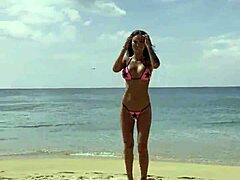 Monika Fox Poses Gracefully in Pink Bikini on Sunny Beach