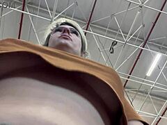 This guy secretly films a woman with hidden phone as she masturbates her big tits while shopping in the supermarket.