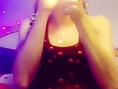 She lights up smokes while slowly stripping clothes off seductively